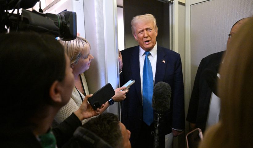 US President Donald Trump speaks with journalist on board Air Force One on route from Miami, Florida, to the White House in Washington, DC on February 19, 2025. (Photo by ROBERTO SCHMIDT / AFP) (Photo by ROBERTO SCHMIDT/AFP via Getty Images)