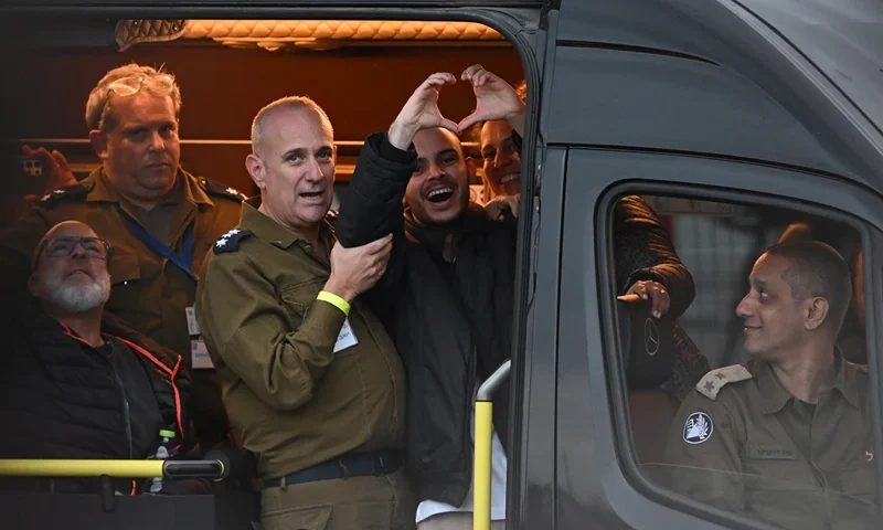 Released hostage Omer Wenkert reacts as he celebrates his release while being driven to Beilinson Hospital on February 22, 2025 in Petah Tikva, Israel. The six hostages released by Hamas today are Tal Shoham, Omer Shem-Tov, Eliya Cohen, Omer Wenkert, Avera Mengistu and Hisham al-Sayed. Israel is expected to release more than 600 Palestinian prisoners as part of a ceasefire agreement between the both sides. (Photo by Alexi J. Rosenfeld/Getty Images)