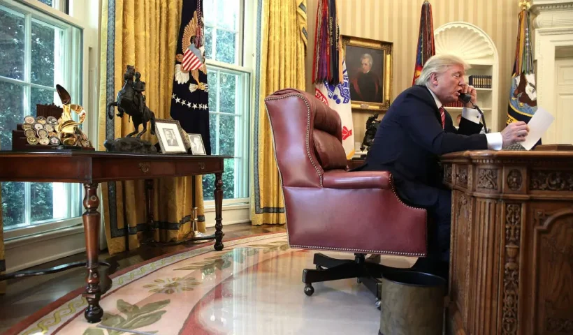 WASHINGTON, DC - JUNE 27: U.S. President Donald Trump speaks on the phone with Irish Prime Minister Leo Varadkar on the phone in the Oval Office of the White House June 27, 2017 in Washington, DC. President Trump congratulated Prime Minister Varadkar to become the new leader of Ireland. (Photo by Alex Wong/Getty Images)