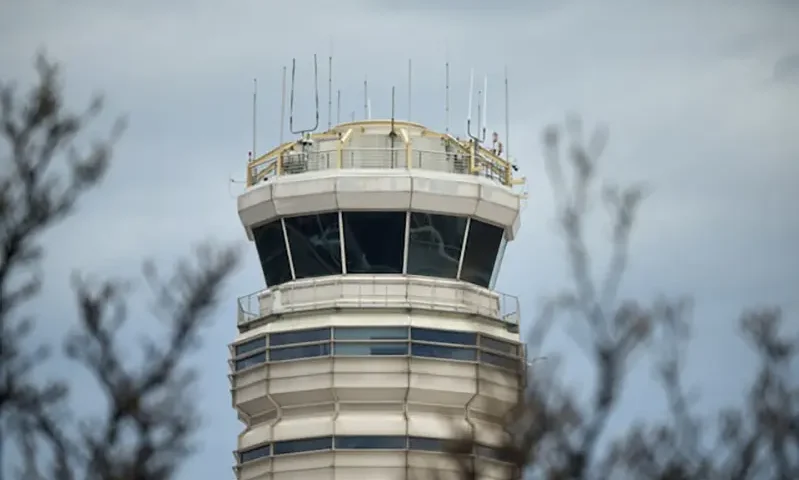 A view of the air traffic control tower at the Ronald Reagan Washington National Airport in Arlington, Virginia, U.S., January 31, 2025. REUTERS/Jeenah Moon/File Photo