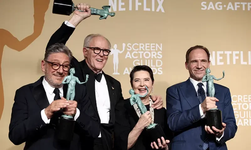 John Lithgow, Ralph Fiennes, Sergio Castellitto and Isabella Rossellini pose with the award for Outstanding Performance by a Cast in a Motion Picture for "Conclave" at the 31st Screen Actors Guild Awards. REUTERS/Daniel Cole