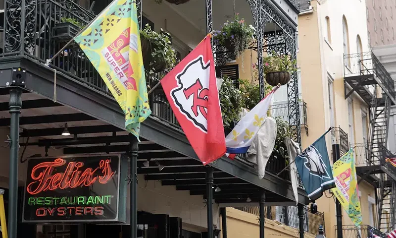 Kansas City Chiefs and Philadelphia Eagles flags at Felix's Oyster restaurant on Bourbon Street. Mandatory Credit: Kirby Lee-Imagn Images