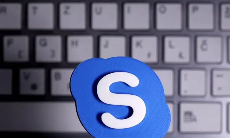 A 3D printed Skype logo is placed in front of a keyboard in this illustration taken April 12, 2020. REUTERS/Dado Ruvic/Illustration/File Photo