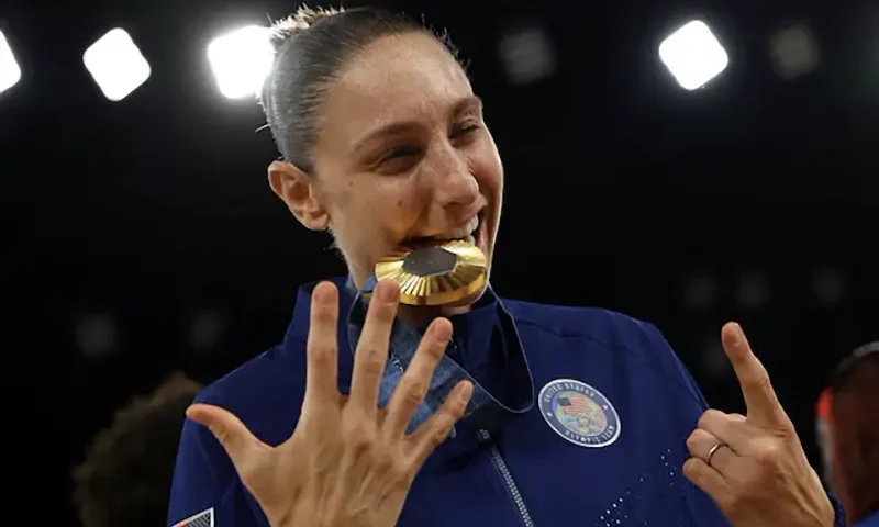 Diana Taurasi of United States celebrates her sixth Olympic gold medal after 2004, 2008, 2012, 2016 and 2020, the most Olympic gold medals by a United States basketball player. REUTERS/Brian Snyder/File Photo