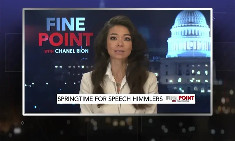 Video still of the host of Fine Point at the desk of their talk show on One America News Network.