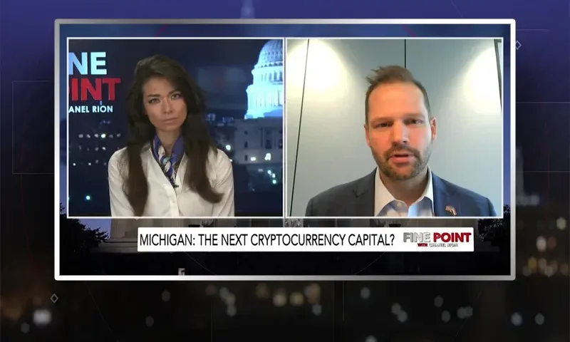 Video still from Fine Point on One America News Network showing a split screen of the host on the left side, and on the right side is the guest, Bryan Posthumus.
