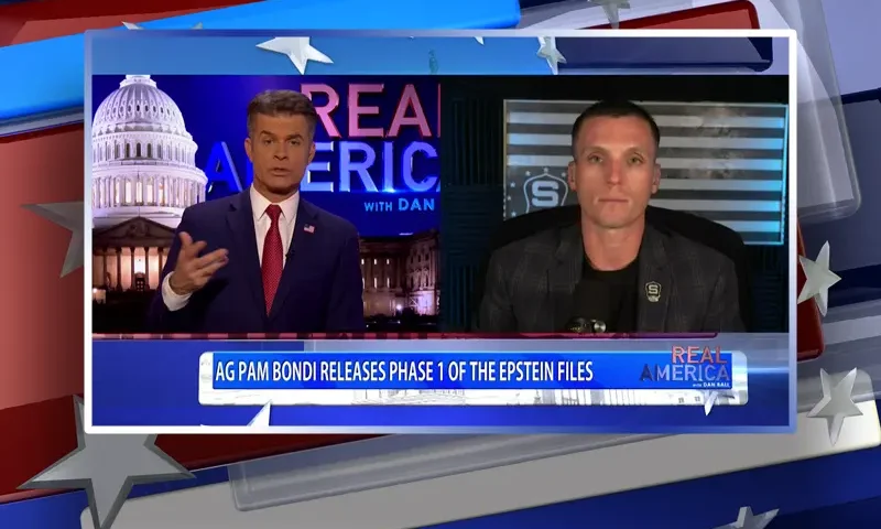 Video still from Real America on One America News Network showing a split screen of the host on the left side, and on the right side is the guest, Steve Friend.