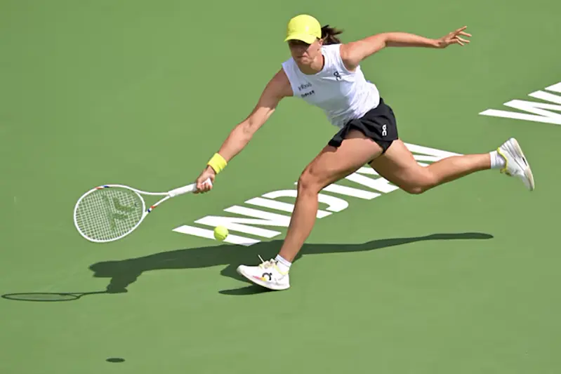 Iga Swiatek (POL) hits a shot as she defeated Karolina Muchova (not pictured) during her fourth round match in the BNP Paribas Open the at Indian Well Tennis Garden. Mandatory Credit: Jayne Kamin-Oncea-Imagn Images/File Photo