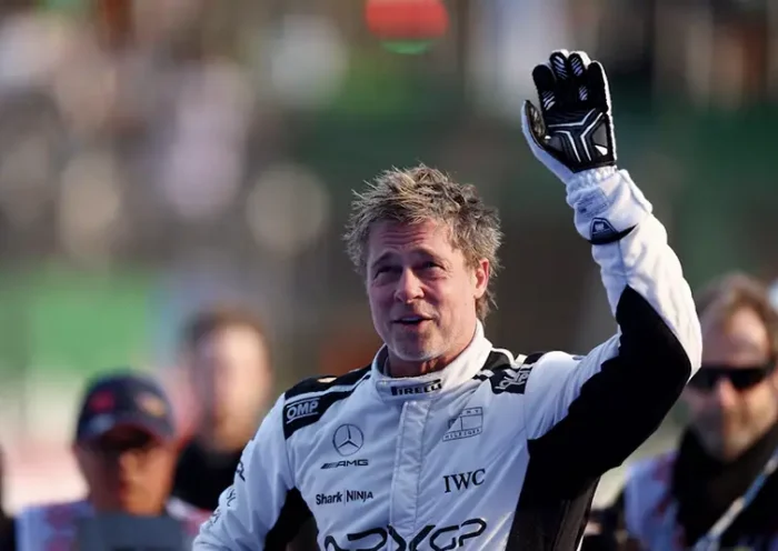 Actor Brad Pitt waves at fans during filming for an F1-inspired movie REUTERS/Raquel Cunha/File Photo