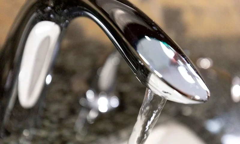 Tap water is seen in this photo illustration in Washington, DC, on August 19, 2019. - A study published on August 19, 2019 links exposure to fluoridated tap water during pregnancy to lower IQ scores in infants, but several outside experts expressed concern over its methodology and questioned its findings. Fluoride has been added to community water supplies in industrial countries to prevent tooth decay since the 1950s. Very high levels of the mineral have been found to be toxic to the brain, though the concentrations seen in fluoridated tap water are generally deemed safe. (Photo by Alastair Pike / AFP) (Photo credit should read ALASTAIR PIKE/AFP via Getty Images)