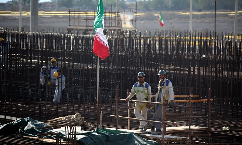A picture taken on November 10, 2019, shows workers on a construction site in Iran's Bushehr nuclear power plant during an official ceremony to kick-start works for a second reactor at the facility. - Bushehr is Iran's only nuclear power station and is currently running on imported fuel from Russia that is closely monitored by the UN's International Atomic Energy Agency. (Photo by ATTA KENARE / AFP) (Photo by ATTA KENARE/AFP via Getty Images)