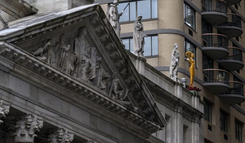 TOPSHOT - Shahzia Sikanders sculpture Now (R) stands atop the courthouse of the Appellate Division First Department of the Supreme Court near Madison Square Park as part of her multimedia exhibition Havahto breathe, air, life on February 7, 2023, in New York City. - Pakistani-American artist Shahzia Sikander, whose statues "NOW" and "Witness" stand majestically on the ledge of a neoclassical New York Supreme Court building and in the adjoining Madison Park in Manhattan, wants to raise awareness about the low artistic representation of women in public space and the political, social and economic discrimination they face. - RESTRICTED TO EDITORIAL USE - MANDATORY MENTION OF THE ARTIST UPON PUBLICATION - TO ILLUSTRATE THE EVENT AS SPECIFIED IN THE CAPTION (Photo by ANGELA WEISS / AFP) / RESTRICTED TO EDITORIAL USE - MANDATORY MENTION OF THE ARTIST UPON PUBLICATION - TO ILLUSTRATE THE EVENT AS SPECIFIED IN THE CAPTION / TO GO WITH AFP STORYby Nicolas REVISE and Diane DESOBEAU, - RESTRICTED TO EDITORIAL USE - MANDATORY MENTION OF THE ARTIST UPON PUBLICATION - TO ILLUSTRATE THE EVENT AS SPECIFIED IN THE CAPTION (Photo by ANGELA WEISS/AFP via Getty Images)