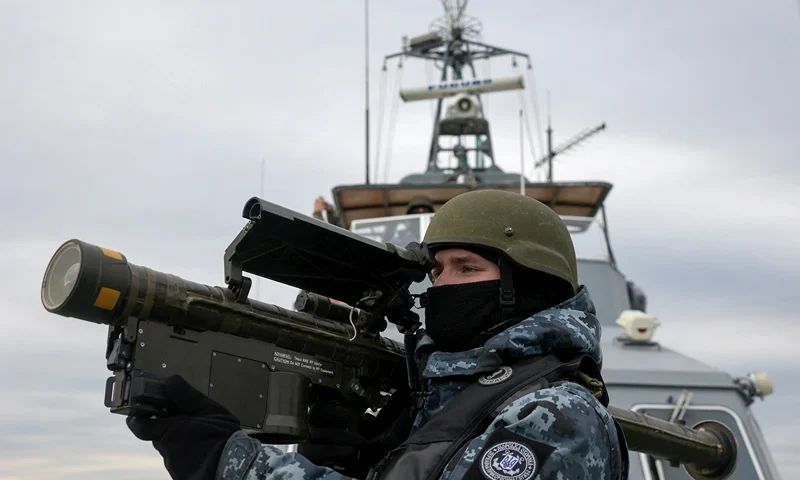 TOPSHOT - A Ukrainian serviceman holds a MANPADS (Man-Portable Air-Defence Systems) "Stinger" anti-aircraft weapon as they scan for possible air targets, onboard a Maritime Guard of the State Border Service of Ukraine boat as it patrols in the northwestern part of the Black Sea on December 18, 2023, amid the Russian invasion of Ukraine. This boat is part of Kyiv's strategy aimed at keeping the Russian military fleet away from the Ukrainian coast, with the key mission of securing the corridor set up since August between Ukrainian ports in the Odessa region and the Bosphorus Strait, after Moscow slammed the door on an international grain agreement. (Photo by Anatolii Stepanov / AFP) (Photo by ANATOLII STEPANOV/AFP via Getty Images)