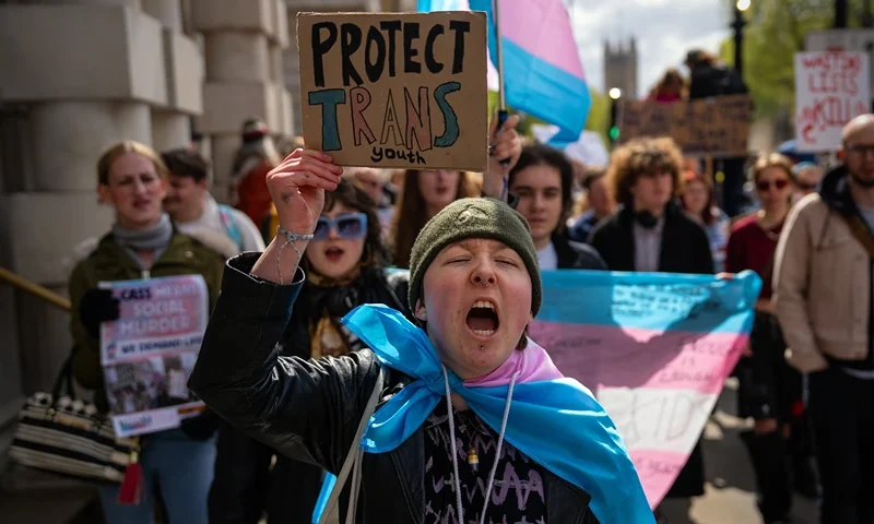 LONDON, ENGLAND - APRIL 20: Trans rights activists take part in a protest against the ban on hormone blockers on April 20, 2024 in London, England. After Dr Hilary Cass delivered her report on NHS gender identity services for children and young people, analysis found most research underpinning clinical guidelines, hormone treatments and puberty blockers to be low quality and the treatments for gender dysphoria have been suspended. The Trans community are protesting against this ban. (Photo by Carl Court/Getty Images)