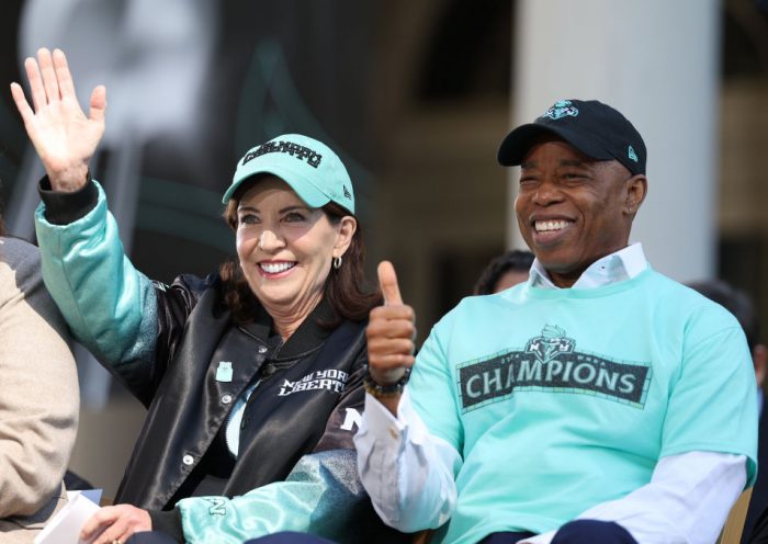 NEW YORK, NEW YORK - OCTOBER 24: Governor of New York Kathy Hochul (L) and New York City Mayor Eric Adams react on stage during the New York Liberty Championship ticker tape parade celebrating winning the 2024 WNBA Finals on October 24, 2024 in New York City. NOTE TO USER: User expressly acknowledges and agrees that, by downloading and/or using this photograph, user is consenting to the terms and conditions of the Getty Images License Agreement. (Photo by Elsa/Getty Images)