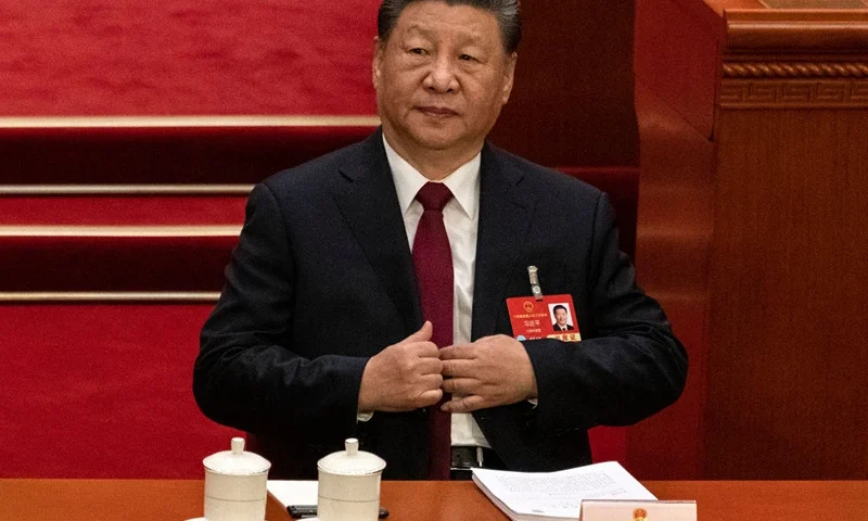 BEIJING, CHINA - MARCH 5: Chinese President Xi Jinping adjusts his jacket as he listens at the opening session of the National People's Congress, or NPC, at the Great Hall of the People on March 5, 2025 in Beijing, China. China's annual political gathering known as the Two Sessions will convene leaders and lawmakers to set the government's agenda for domestic economic and social development for the year. (Photo by Kevin Frayer/Getty Images)