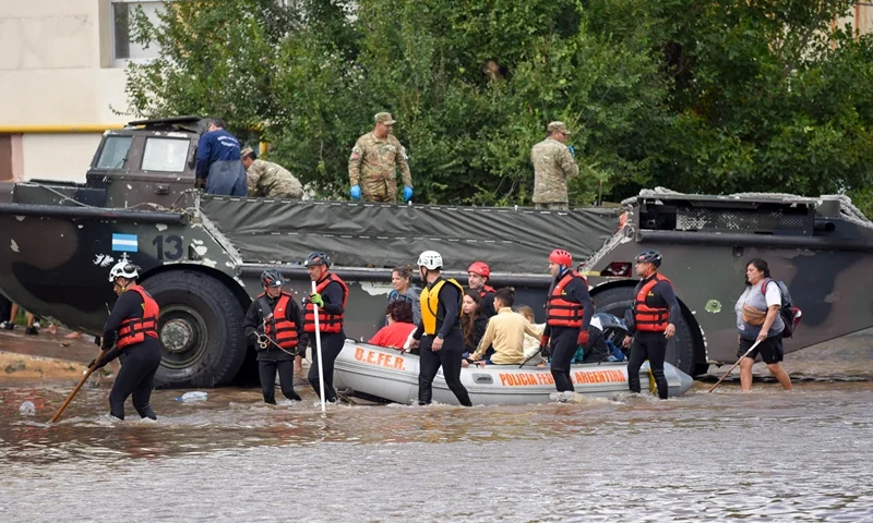 People is transported on a police boat through flooded waters the day after a heavy storm in Bahia Blanca, 600 km south of Buenos Aires on March 8, 2025. At least ten people died and more than 1,000 were evacuated in the Argentine port city of Bahia Blanca as torrential rains flooded homes and hospitals, destroyed roads and forced authorities to cut the power. (Photo by PABLO PRESTI / AFP) (Photo by PABLO PRESTI/AFP via Getty Images)