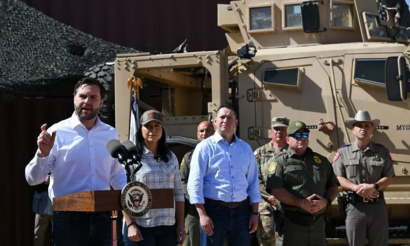 EAGLE PASS, TEXAS - MARCH 05: U.S. Vice President JD Vance (L) speaks as Director of National Intelligence Tulsi Gabbard (2nd-L) and members of U.S. Border Patrol look on during a visit to the U.S.-Mexico border on March 05, 2025 in Eagle Pass, Texas. Vance is visiting the southern border to tour operations and meet with local, state, and federal officials regarding the significant decline in illegal crossings since U.S. President Donald Trump began his second term. The Trump administration has implemented strict immigration policies including a crackdown on illegal migrant crossings and plans for mass deportations. (Photo by Brandon Bell/Getty Images)