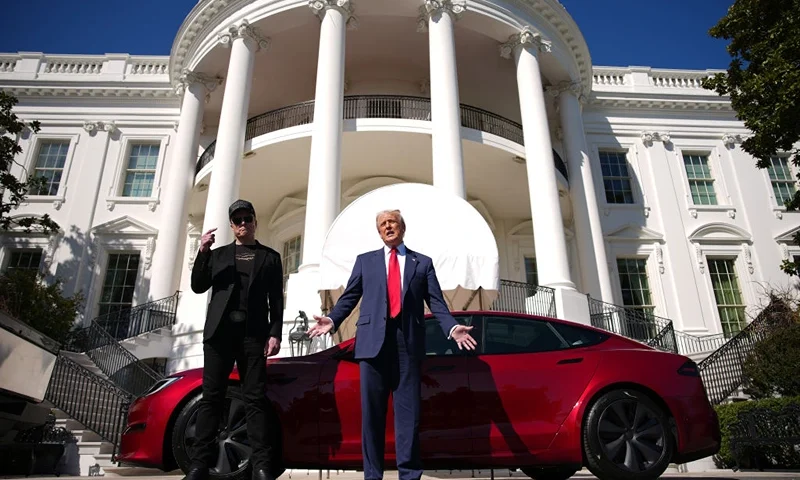 President Donald Trump and White House Senior Advisor, Tesla and SpaceX CEO Elon Musk deliver remarks next to a Tesla Model S on the South Lawn of the White House on March 11, 2025 in Washington, DC. Trump spoke out against calls for a boycott of Elon Musk’s companies and said he would purchase a Tesla vehicle in what he calls a ‘show of confidence and support’ for Elon Musk. (Photo by Andrew Harnik/Getty Images)
