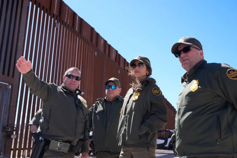 US Secretary of Homeland Security Kristi Noem (2R) listens during a tour along the Nogales border wall at the Mariposa Port of Entry in Nogales, Arizona, March 15, 2025. (Photo by Alex Brandon / POOL / AFP) (Photo by ALEX BRANDON/POOL/AFP via Getty Images)