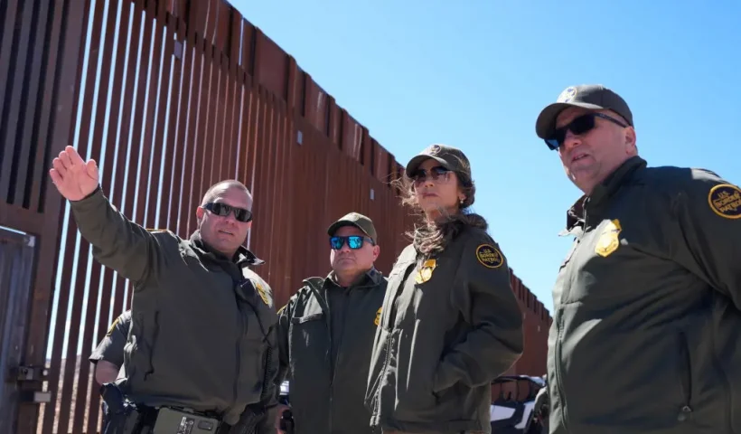 US Secretary of Homeland Security Kristi Noem (2R) listens during a tour along the Nogales border wall at the Mariposa Port of Entry in Nogales, Arizona, March 15, 2025. (Photo by Alex Brandon / POOL / AFP) (Photo by ALEX BRANDON/POOL/AFP via Getty Images)