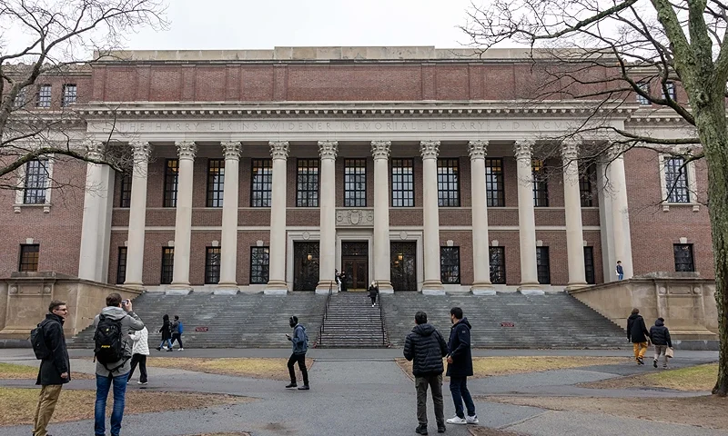 CAMBRIDGE, MASSACHUSETTS - MARCH 17: People gather outside Widener Library on Harvard University's campus on March 17, 2025 in Cambridge, Massachusetts. Harvard University announced free tuition for students from families that make under $200K a year. (Photo by Scott Eisen/Getty Images)