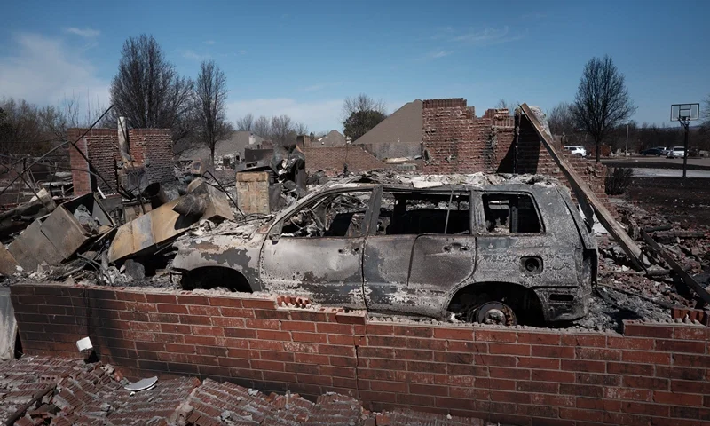 A burned out vehicle sits in the garage of a home that was destroyed during Friday's wildfires on March 16, 2025 in Stillwater, Oklahoma. Governor Kevin Stitt said that the wildfires, fueled by high winds, burned around 170,000 acres and damaged well over 200 homes and structures in the state. (Photo by Scott Olson/Getty Images)