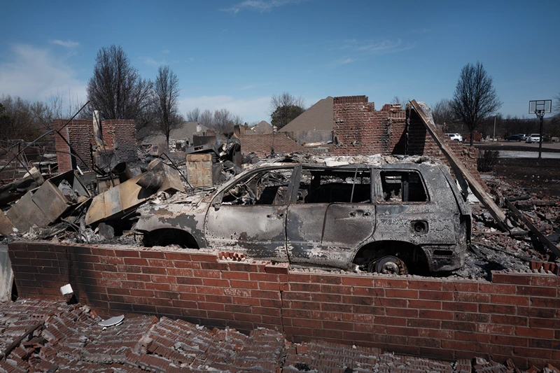 A burned out vehicle sits in the garage of a home that was destroyed during Friday's wildfires on March 16, 2025 in Stillwater, Oklahoma. Governor Kevin Stitt said that the wildfires, fueled by high winds, burned around 170,000 acres and damaged well over 200 homes and structures in the state. (Photo by Scott Olson/Getty Images)
