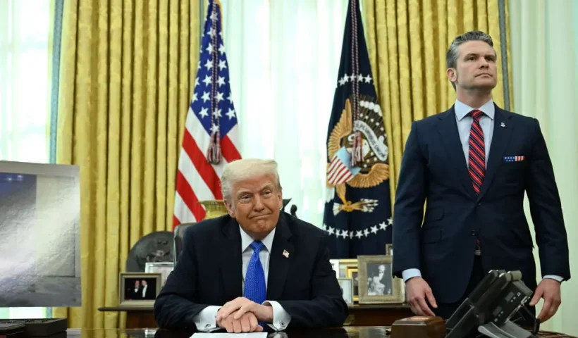 US President Donald Trump and Secretary of Defense Pete Hegseth prepare to speak to the press in the Oval Office of the White House in Washington, DC, on March 21, 2025. (Photo by Annabelle Gordon / AFP) (Photo by ANNABELLE GORDON/AFP via Getty Images)
