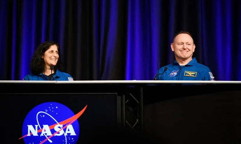NASA astronauts Suni Williams (L) and Butch Wilmore laugh while answering questions during NASA's SpaceX Crew-9 post-flight news conference at the Johnson Space Center in Houston, Texas, on March 31, 2025. After an unexpected nine-month stay in space, the pair of NASA astronauts finally returned to Earth on March 18, 2025, concluding a mission that captured global attention and became a political flashpoint. (Photo by Mark Felix / AFP) (Photo by MARK FELIX/AFP via Getty Images)
