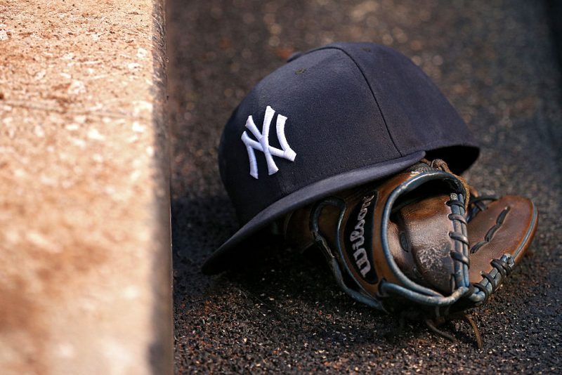 BALTIMORE, MD - MAY 05: A detail view of a New York Yankees hat and Wilson baseball glove at Oriole Park at Camden Yards on May 5, 2016 in Baltimore, Maryland. The Baltimore Orioles won, 1-0, in the tenth inning.(Photo by Patrick Smith/Getty Images)