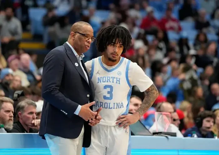 North Carolina Tar Heels head coach Hubert Davis talks with guard Elliot Cadeau (3) in the second half at Dean E. Smith Center. Mandatory Credit: Bob Donnan-Imagn Images/File Photo