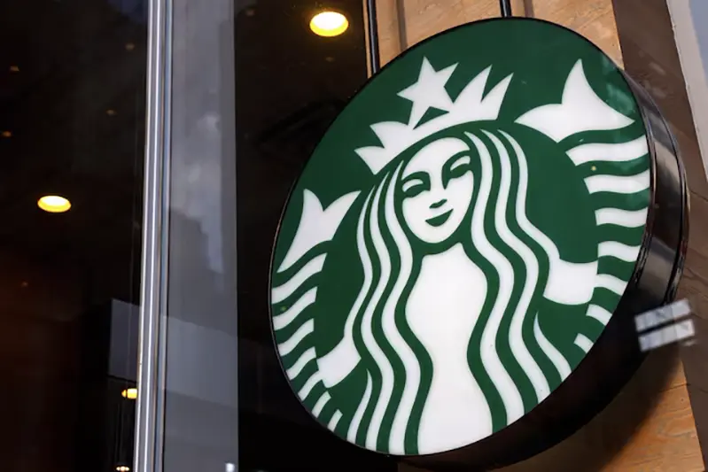 A Starbucks store sign is seen in New York City, U.S., February 25, 2025. REUTERS/Shannon Stapleton