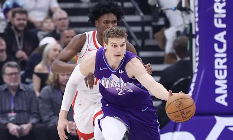 Utah Jazz forward Lauri Markkanen (23) brings the ball up the court against Houston Rockets forward Amen Thompson (back) during the first half at Delta Center. Mandatory Credit: Rob Gray-Imagn Images/File Photo