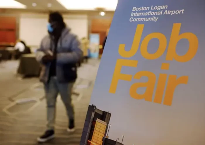 A job seeker leaves the job fair for airport related employment at Logan International Airport in Boston, Massachusetts, U.S., December 7, 2021. REUTERS/Brian Snyder/File Photo