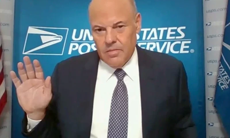 In this screenshot from U.S. Senate's livestream, U.S. Postal Service Postmaster General Louis DeJoy is sworn in for a virtual Senate Homeland Security and Governmental Affairs Committee hearing. (Photo by U.S. Senate Homeland Security and Governmental Affairs Committee via Getty Images)
