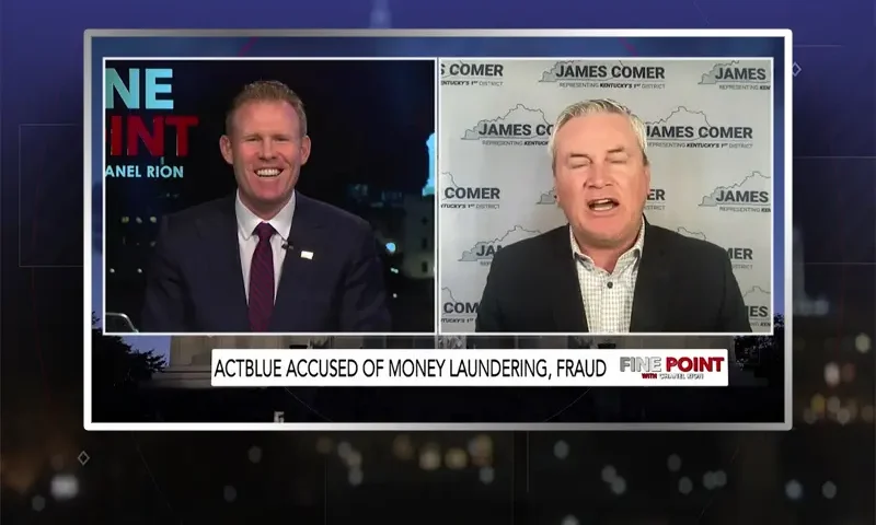 Video still from Fine Point on One America News Network showing a split screen of the host on the left side, and on the right side is the guest, James Comer.