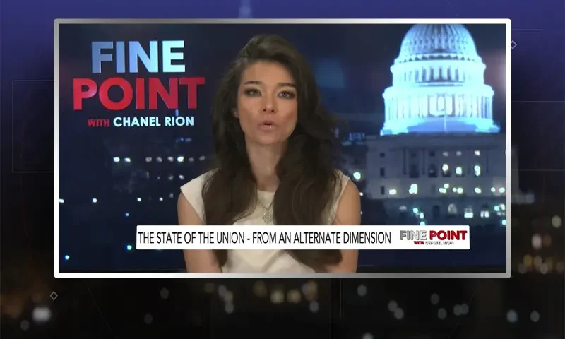 Video still of the host of Fine Point at the desk of their talk show on One America News Network.