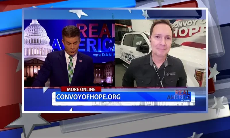 Video still from Real America on One America News Network showing a split screen of the host on the left side, and on the right side is the guest, Ethan Forhetz.