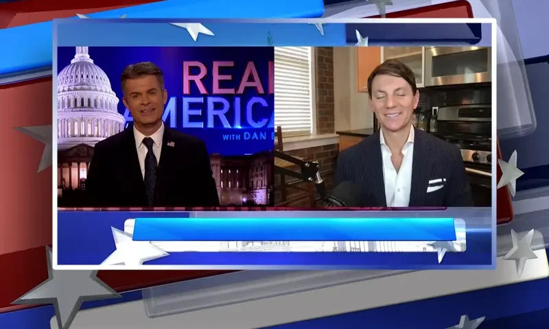 Video still from Real America on One America News Network showing a split screen of the host on the left side, and on the right side is the guest, Hogan Gidley.
