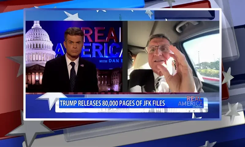 Video still from Real America on One America News Network showing a split screen of the host on the left side, and on the right side is the guest, Michael Flynn.