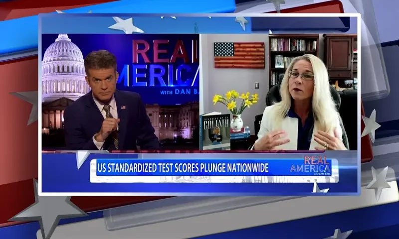 Video still from Real America on One America News Network showing a split screen of the host on the left side, and on the right side is the guest, Rebecca Friedrichs.