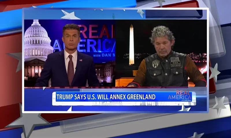 Video still from Real America on One America News Network showing a split screen of the host on the left side, and on the right side is the guest, Chris Cox.
