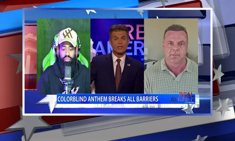 Video still from Real America on One America News Network during an interview with guests Chris Darlington and The Marine Rapper.