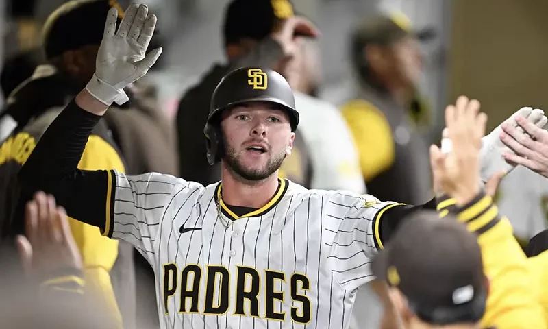 San Diego Padres center fielder Jackson Merrill (3) is congratulated after hitting a solo home run during the fourth inning against the Cleveland Guardians at Petco Park. Mandatory Credit: Denis Poroy-Imagn Images