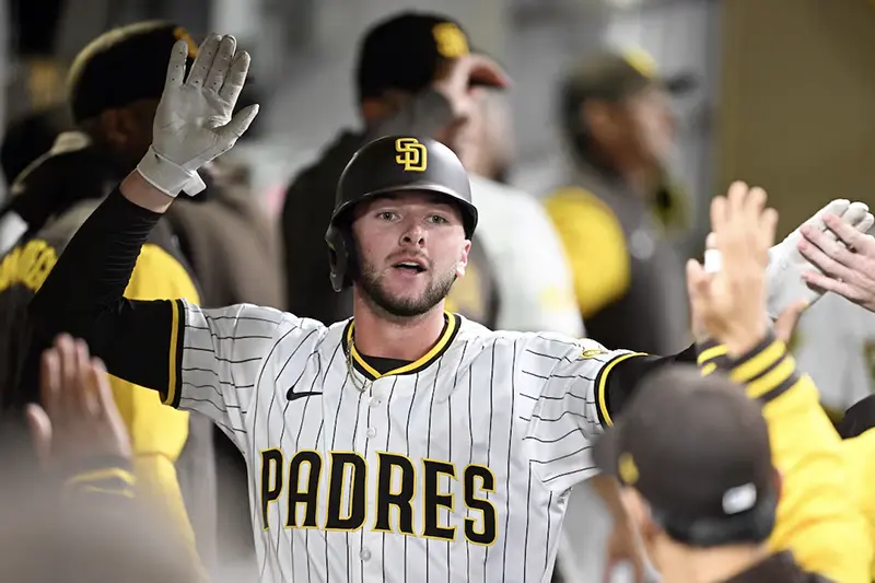 San Diego Padres center fielder Jackson Merrill (3) is congratulated after hitting a solo home run during the fourth inning against the Cleveland Guardians at Petco Park. Mandatory Credit: Denis Poroy-Imagn Images
