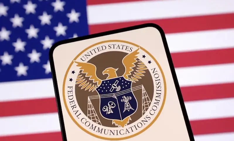 United States Federal Communications Commission logo and U.S. flag are seen in this illustration taken April 23, 2025. REUTERS/Dado Ruvic/Illustration