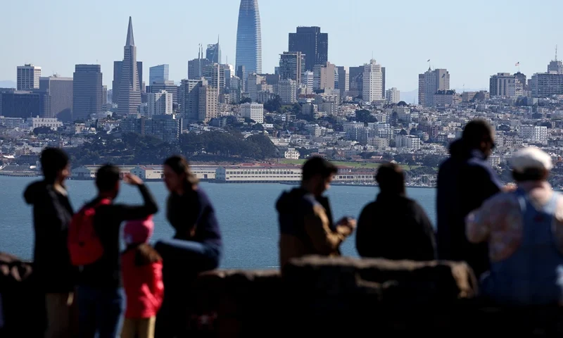 SAUSALITO, CALIFORNIA - OCTOBER 24: Visitors look at the San Francisco skyline from a vista point on October 24, 2022 in Sausalito, California. The State of California, currently the fifth largest economy in the world, is likely to overtake Germany as the fourth largest economy in the near future as the state's gross domestic product is continuing to rise with steady growth. (Photo by Justin Sullivan/Getty Images)