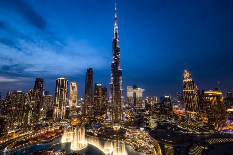 TOPSHOT - The Dubai skyline including Burj Khalifa (C), the world's tallest building, is pictured after sunset on December 31, 2024. (Photo by FADEL SENNA / AFP) (Photo by FADEL SENNA/AFP via Getty Images)