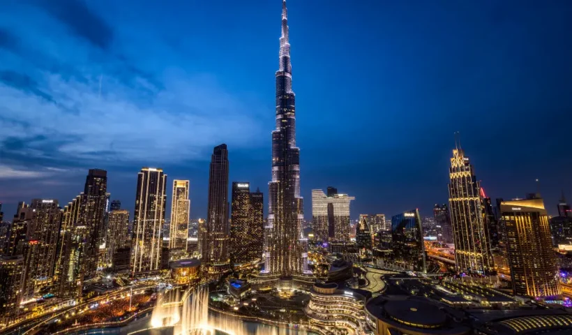 TOPSHOT - The Dubai skyline including Burj Khalifa (C), the world's tallest building, is pictured after sunset on December 31, 2024. (Photo by FADEL SENNA / AFP) (Photo by FADEL SENNA/AFP via Getty Images)